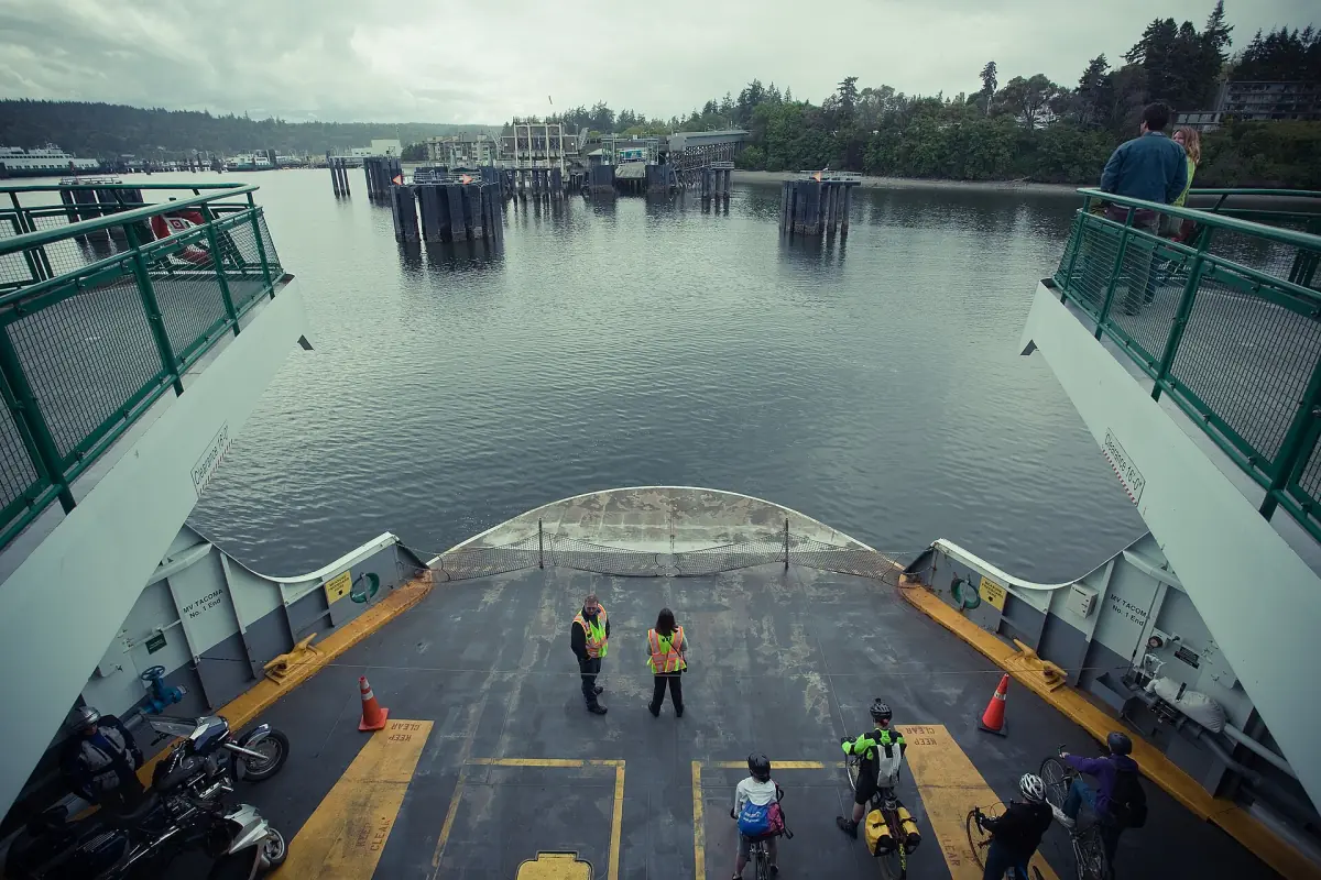 View over the ferry car deck toward the terminal and wooded shore