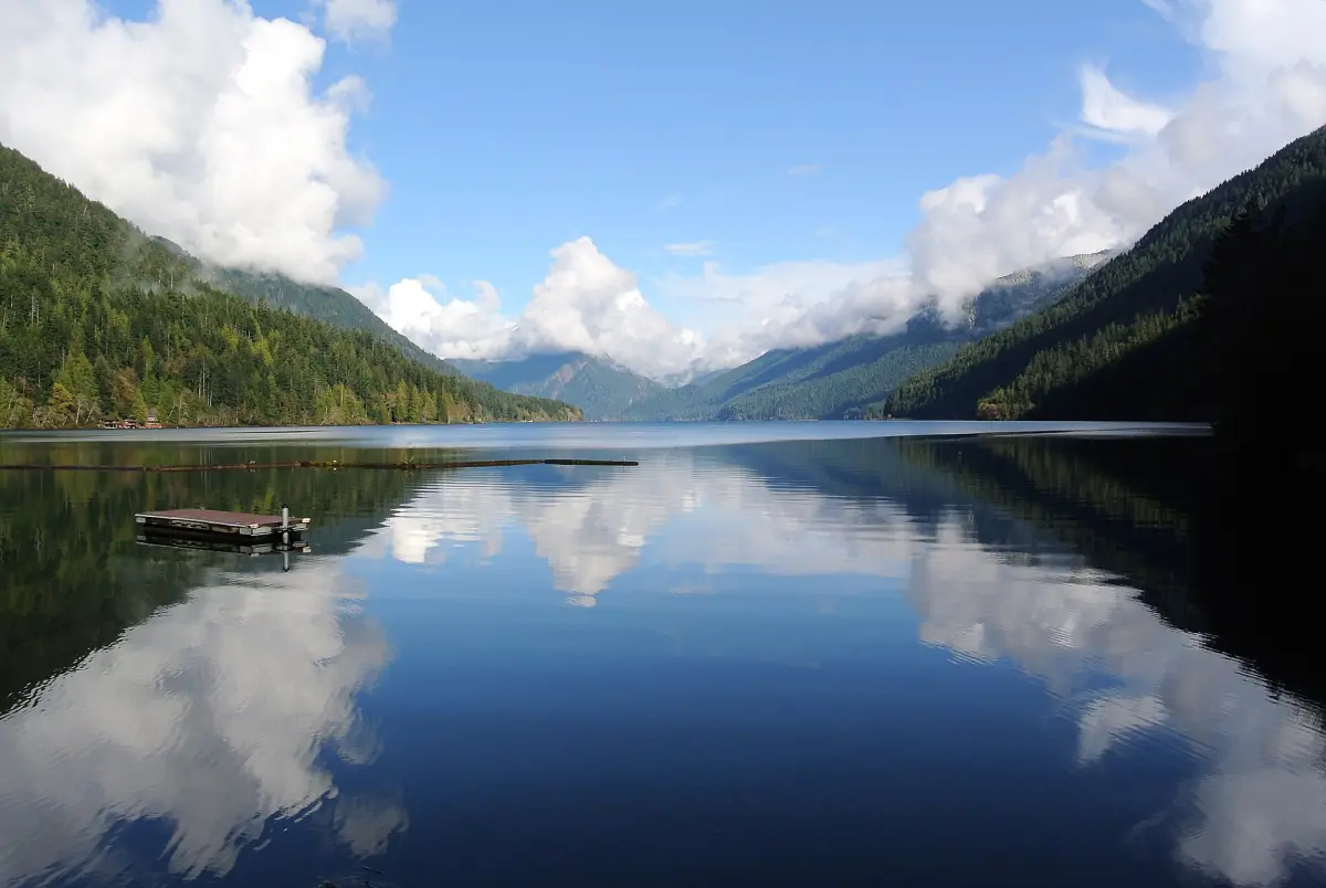 Lake Crescent with mountains reflected in calm blue water