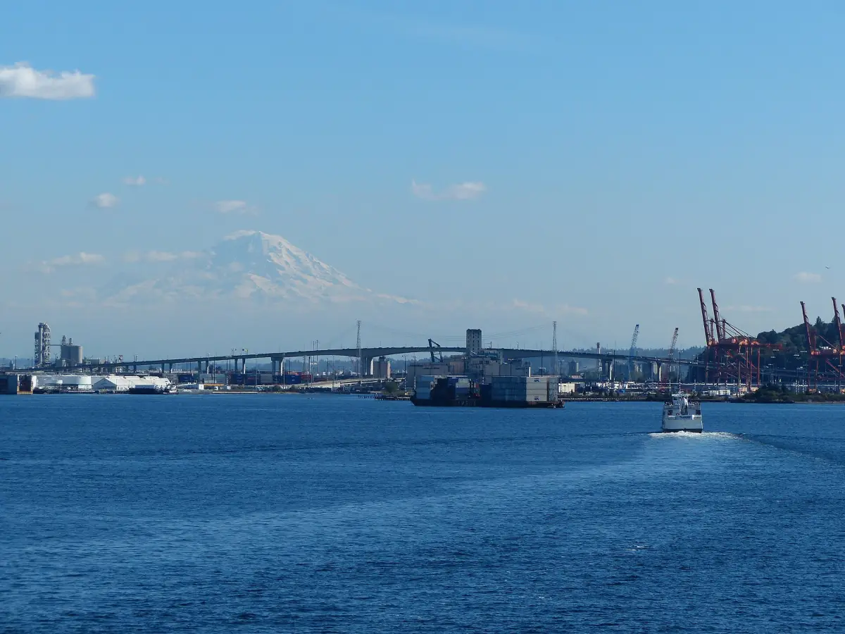 Snow-capped Mount Rainier above the water and the Seattle waterfront