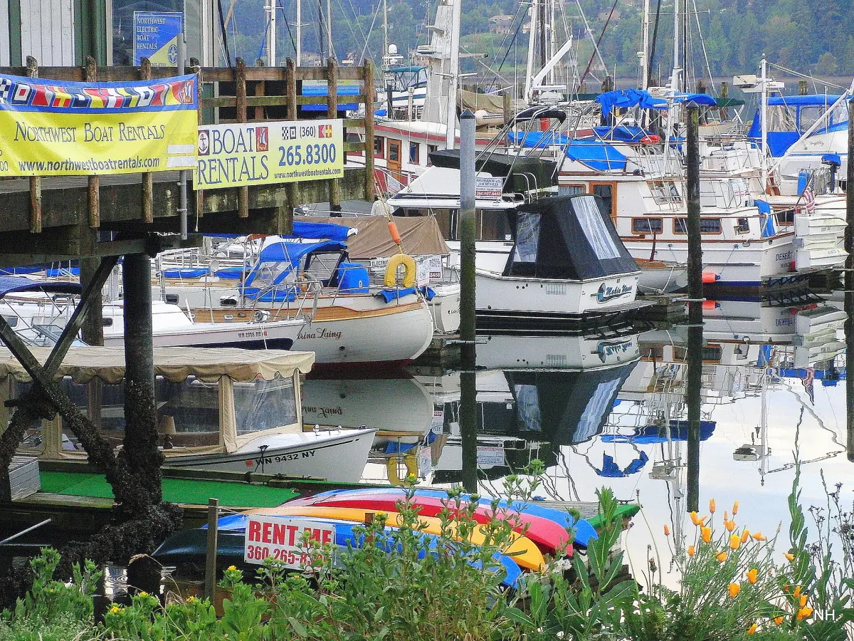 Boats at the marina on the Poulsbo waterfront with flower baskets