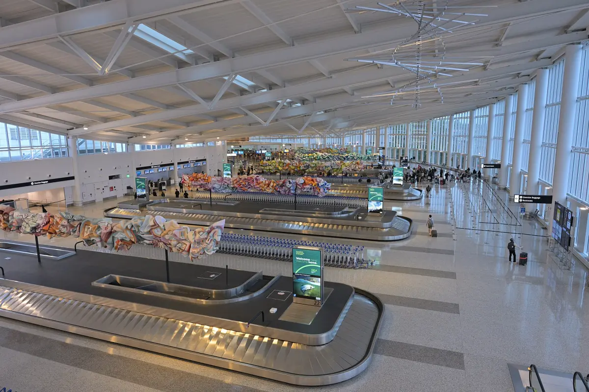 Bright baggage claim hall with carousels at the airport